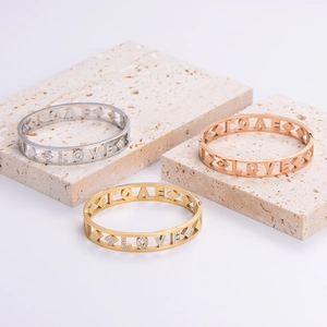Minimalist geometric LOVE open bangle set in gold, rose gold, and silver with fine crystals