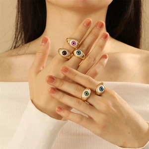 Adjustable gold evil eye rings with multi-color resin stones shown on a model hand