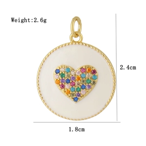Detail view of 18K gold plated heart pendant with dimensions 2.4cm by 1.8cm and weight 2.6g