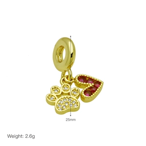 Detail of golden heart and paw print pendant with size 25mm and weight 2.6g