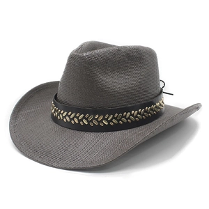 Detail of dark gray straw cowboy hat featuring black leather band and gold metal studs