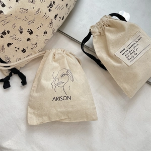 Detailed view of durable cotton canvas drawstring bags with cute cat prints and typography