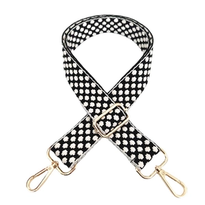 Adjustable wide replacement shoulder strap with black and white knit pattern and gold buckles