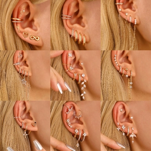 Gold alloy earring set with star and leaf designs, featuring zircon and pearl accents