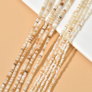 Natural 4mm shell spacers and beads for handmade jewelry on a white display stand