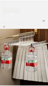 Detail of heavy-duty white multi-clip pants hanger with high load-bearing capacity