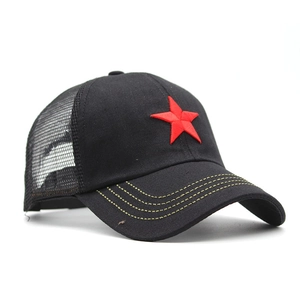 Detail of red star embroidery and yellow stitching on black cotton mesh trucker hat