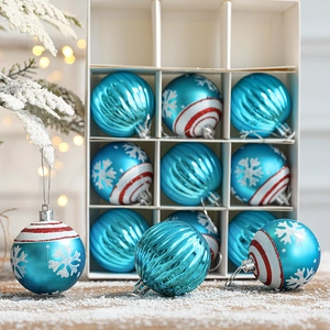 Blue Christmas balls set with snowflake and spiral patterns on snow-covered background