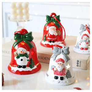 Close-up of LED bell ornaments with Santa and snowman motifs for cozy Christmas decor