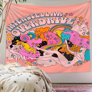 Retro psychedelic Interstellar Overdrive tapestry shown hanging above bedroom bedding