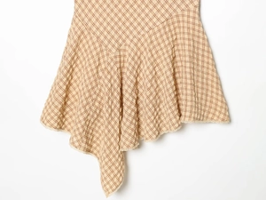 Detail of plaid dress showing beige seersucker fabric texture and delicate lace hem