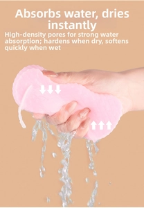 Detailed view of high-density pink PVA sponge showing water absorption and soft texture