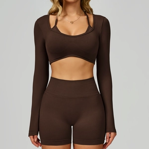 Detail view of coffee brown seamless yoga set with long sleeve crop top and biker shorts