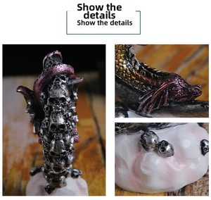 Detail view of gothic resin dragon and skull figurine with antique silver finish