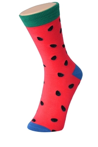 Detail of red cotton sock with watermelon pattern on mannequin foot with blue accents