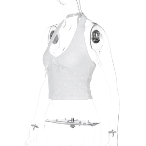 Side view of white lace halter top featuring floral embroidery on a mannequin