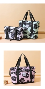 Detail view of the elephant pattern print on the large travel duffel bag with handles