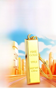 Detail of gold bar keychain with Fine Gold 999.9 engraving and polished mirror finish