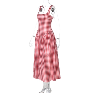 Detail view of red and white plaid pattern on the sleeveless midi dress with square neck