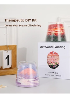 Close-up of DIY sand art scented candle kit with colorful sand in glass containers