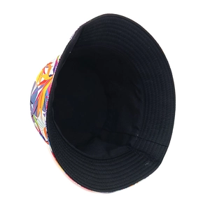 Detail showing reversible bucket hat with tropical floral print and black lining