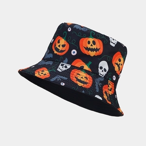 Detail view of the reversible Halloween bucket hat featuring pumpkin and skull patterns