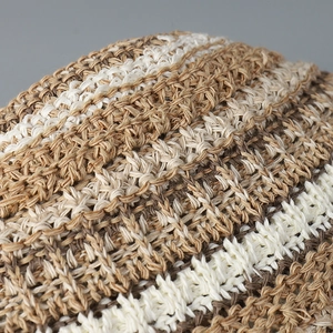 Detailed macro view showing the textured crochet knit pattern and multi-color stripes