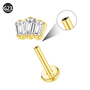 Detail of G23 solid titanium push-fit stud with three emerald cut clear zircons