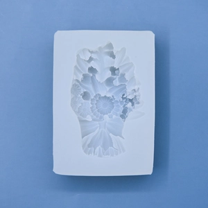 White silicone mold with intricate floral bouquet pattern for cake baking and DIY crafts