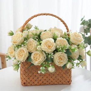 Artificial champagne roses in a woven wooden flower basket for elegant home decor
