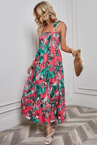 Detail of floral backless maxi dress with tiered skirt and adjustable tie straps
