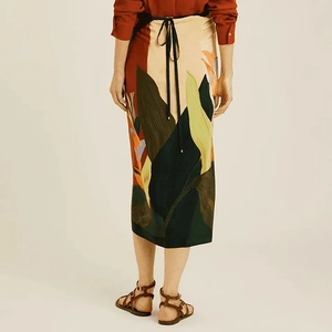 Detail view of the tropical print midi wrap skirt with waist tie for holiday wear