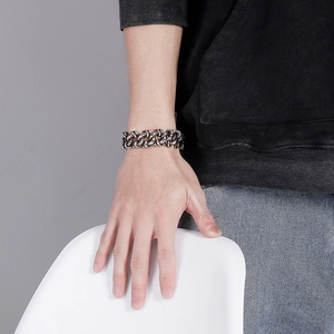 Macro shot of heavy vintage silver stainless steel Cuban link chain bracelet for men