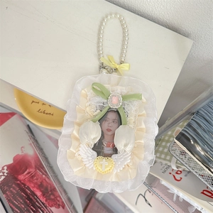 Lace photo card holder detail featuring pearl handle green ribbon bow and tulip decor
