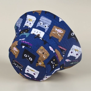 Detailed view of the dark blue bucket hat featuring all-over cartoon cat and fish prints