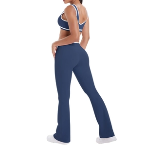 Navy blue yoga set featuring a contrast trim sports bra and high-waist flared pants