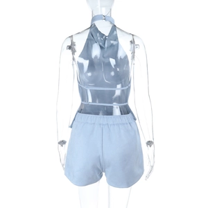 Detail view of light blue two-piece set featuring backless halter top and elastic shorts