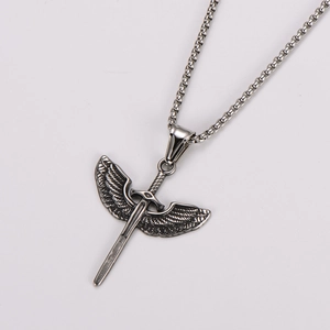 Detail of vintage silver angel wing sword pendant on a stainless steel box chain necklace