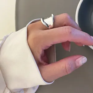 Minimalist 925 sterling silver ring with wide irregular streamline design for women