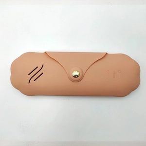 Pink silicone makeup brush holder with embossed pattern for portable travel storage