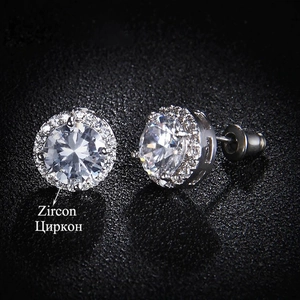 Close-up of classic silver halo stud earrings featuring sparkling round white zircon