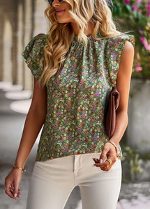 Lifestyle shot of women's green floral sleeveless top with ruffle shoulder detailing