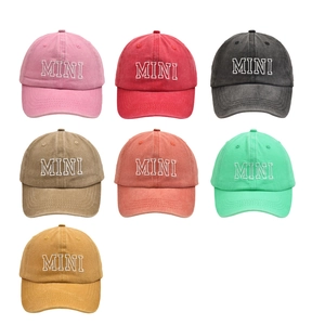 Detailed array of MINI embroidered baseball caps in seven vibrant colors on white backdrop