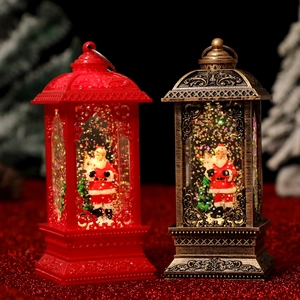 Detailed view of red and bronze Christmas lanterns with Santa Claus and floating glitter