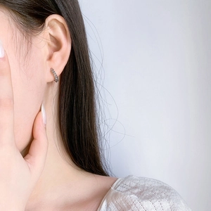 Minimalist S925 sterling silver chain link hoop earrings worn for a delicate look