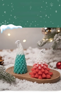 Detail of Christmas tree scented candles made from natural soy wax in red and green tones