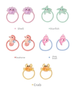 Detail of colorful elastic hair bands with cute resin sea creatures like starfish and shells
