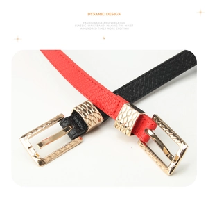 Close-up of litchi texture slim leather belts with decorative gold metal buckles
