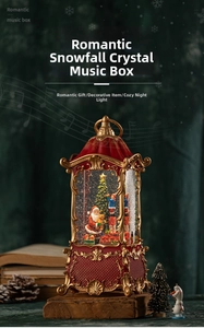 Close-up of vintage Christmas lantern music box with Santa Claus and festive snow scene