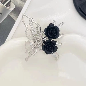 Liquid metal silver butterfly ring with black roses in minimalist gothic style